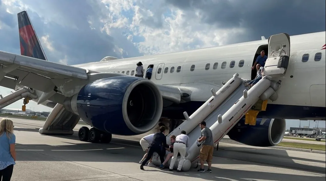 Cockpit Fumes Force Delta Jet Back to Atlanta as More Than 200 People Escape Down Emergency Slides
